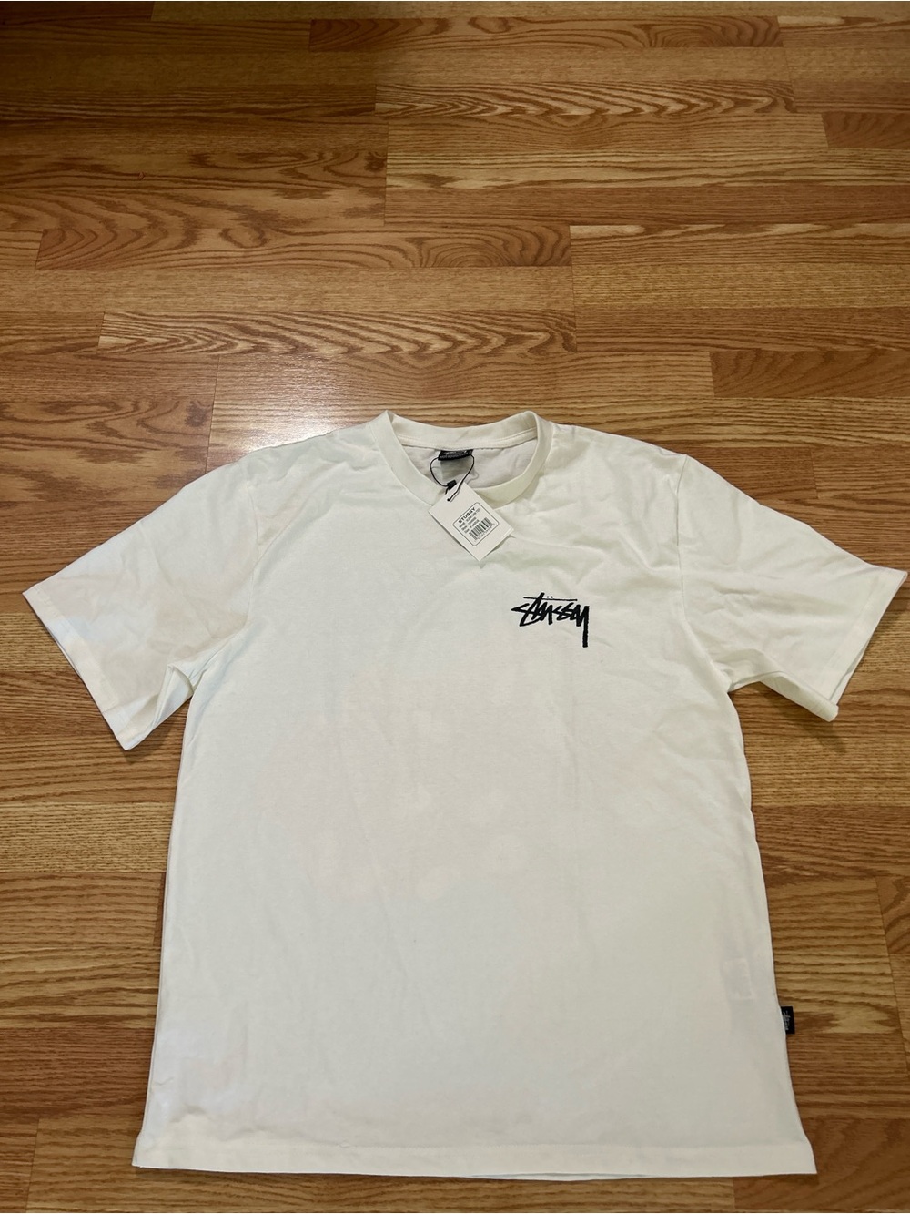 Stussy White Short Sleeve Tee with Black Chest Logo
